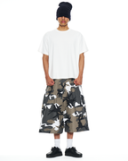 Snow Soldado Shorts by La Raza, oversized snow camo ripstop shorts, front view on model